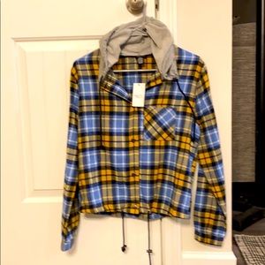New with tags flannel women’s top. Has drawstring